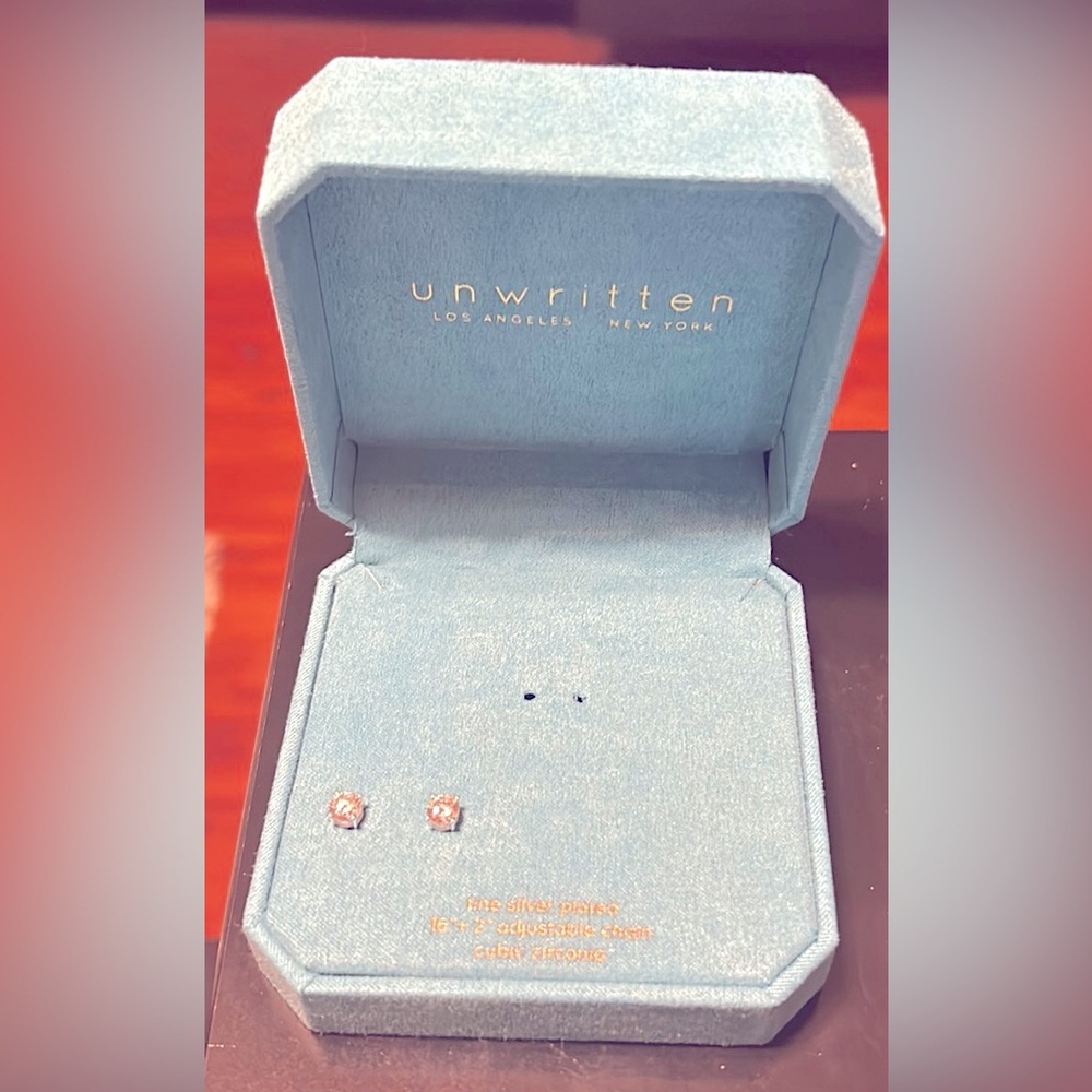 unwritten stud earrings, never worn